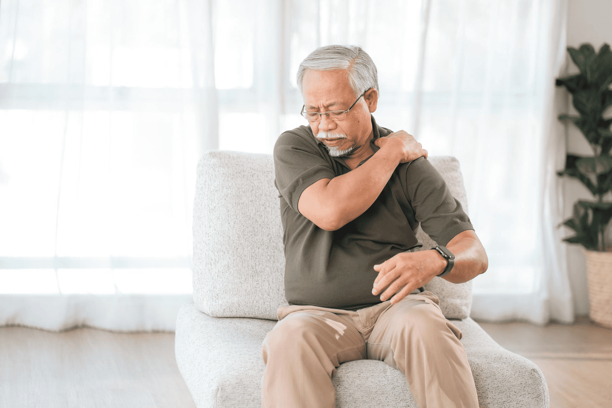 Older Indian man with shoulder pain